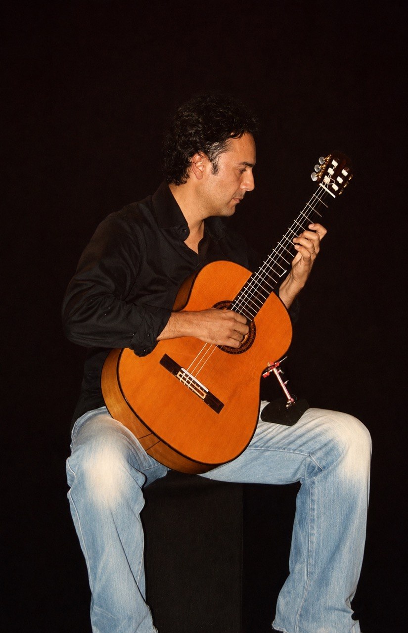 Claudio Garay performing classical guitar